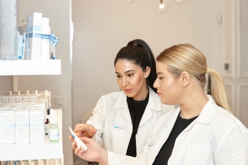 Medical practitioners selecting treatments at their practice - Australian Stock Image