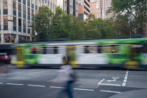 Melbourne tram passing long exposure with motion blur - Australian Stock Image