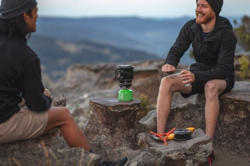 Men camping on mountains - Australian Stock Image