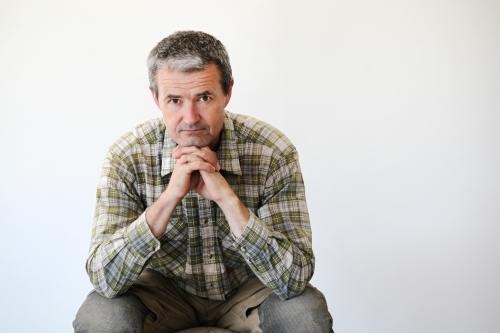 middle-aged man in work clothes - Australian Stock Image