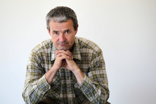 middle-aged man in work clothes - Australian Stock Image