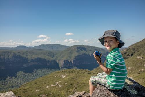 Mixed race boy bush walking in the Blue Mountains - Australian Stock Image