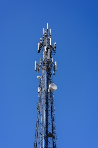 mobile phone communication repeater antenna. cell tower. on the blue sky background. - Australian Stock Image