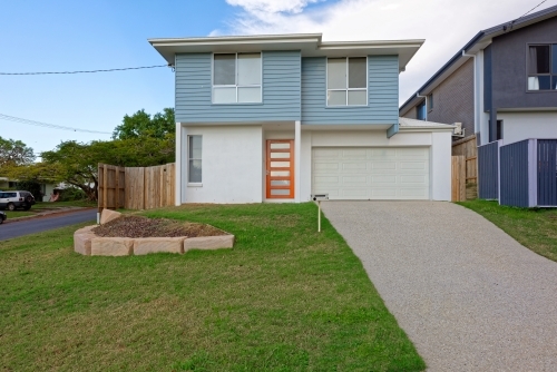 Modern double storey house on a corner block - Australian Stock Image