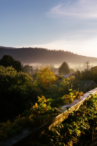 Morning fog over a remote town in Tasmania - Australian Stock Image