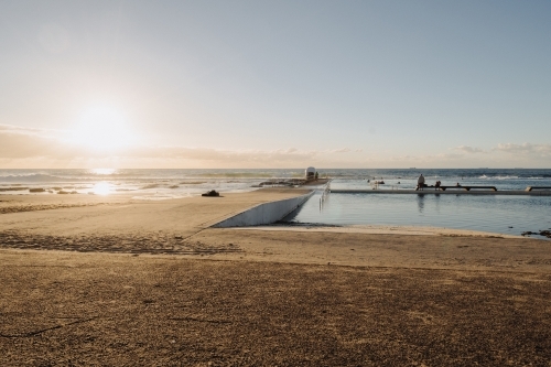 Morning sunrise swim at Merewether Ocean Baths, Newcastle, NSW - Australian Stock Image