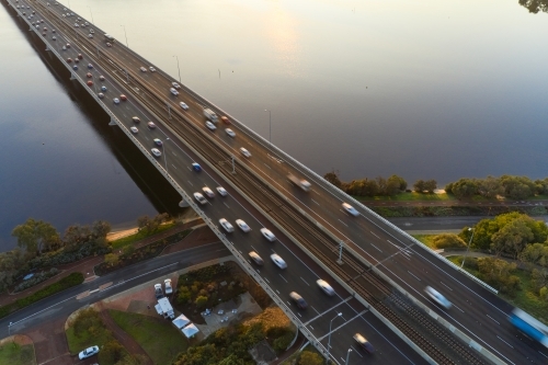 Morning traffic on the freeway crossing the Mt Henry Bridge in Perth, Western Australia - Australian Stock Image