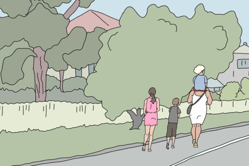 Mother and three children walking along street near green trees - Australian Stock Image