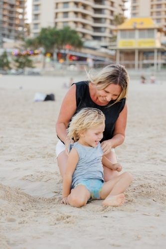 Mother with son on Main Beach at Surfers Paradise on the Gold Coast - Australian Stock Image
