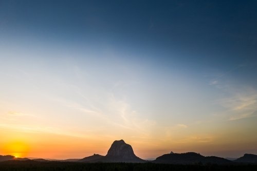 Mount Tibrogragan and the Glasshouse Mountains at Sunset - Australian Stock Image