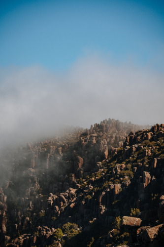 Mountains rugged rock terrain over the coast - Australian Stock Image