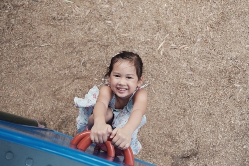 multicultural kid having fun at playground - Australian Stock Image