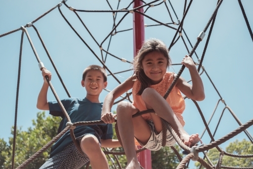 multicultural kids having fun at playground - Australian Stock Image