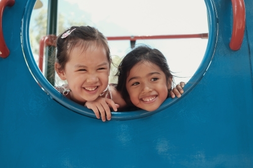 multicultural kids having fun at playground - Australian Stock Image