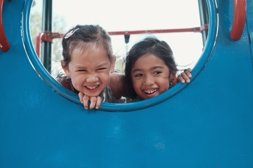 multicultural kids having fun at playground - Australian Stock Image