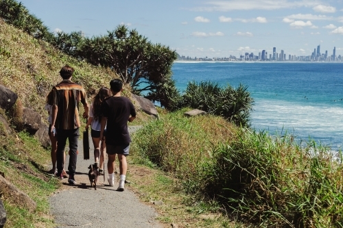 Multicultural teenagers walking near the beach