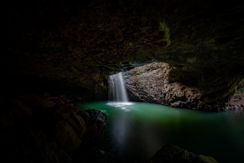 Natural Bridge with waterfall into cave - Australian Stock Image