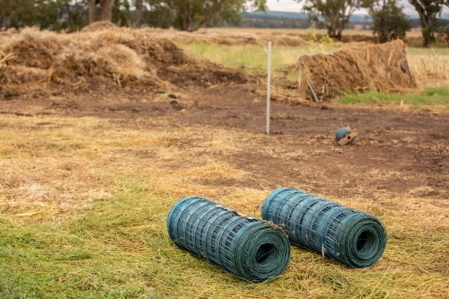 New fencing begins after a flood - Australian Stock Image