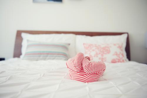 Newborn Baby laying on bed - Australian Stock Image