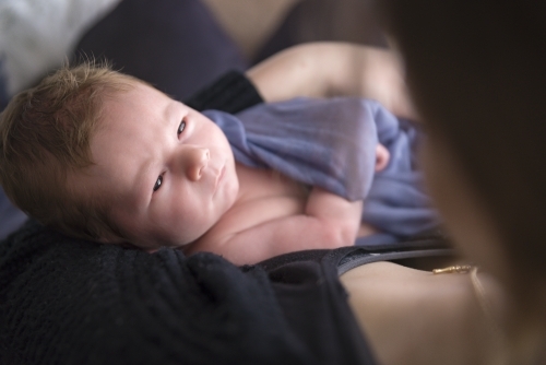 Newborn Baby Looking Into Mothers Eyes - Australian Stock Image