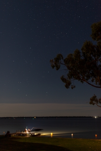 Night fishing off lake jetty - Australian Stock Image