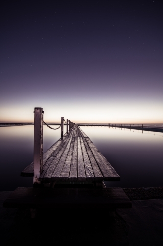 Night time at Narrabeen Rock Pool on Sydney's Northern Beaches - Australian Stock Image