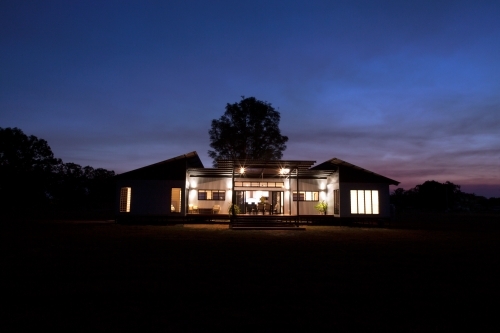 Nighttime shot of a modern architecture home. - Australian Stock Image