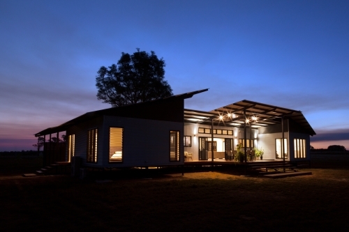 Nighttime shot of a modern architecture home. - Australian Stock Image