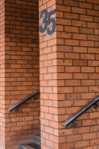 Number 35 on brick walls with handrails and steps - Australian Stock Image