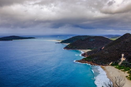 Ocean and mountains with cloudy sky - Australian Stock Image