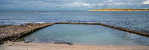 Ocean pool and headland with the horison in panorama - Australian Stock Image