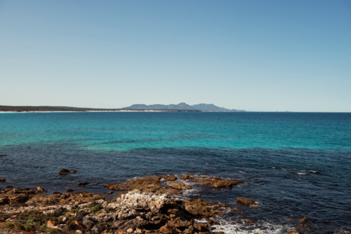 Ocean view towards towards mountains in National Park - Australian Stock Image