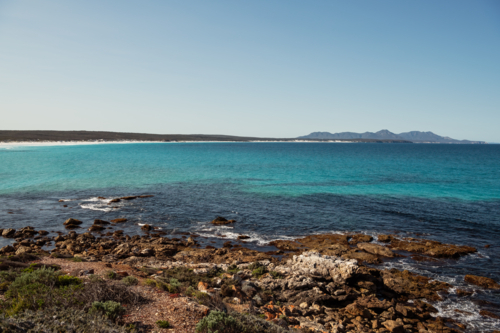 Ocean view towards towards mountains in National Park - Australian Stock Image