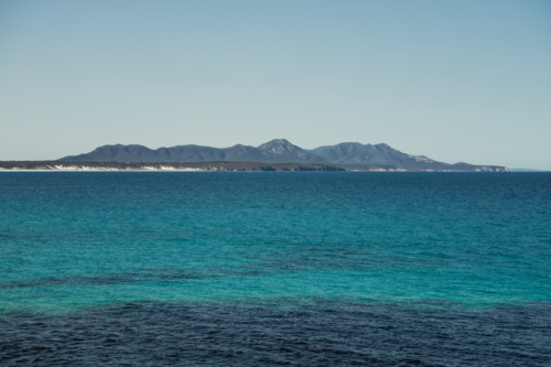 Ocean view towards towards mountains in National Park - Australian Stock Image