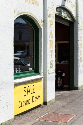 Old building with closing down sign - Australian Stock Image