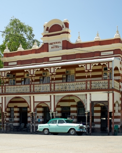 Old car in front of historic rural hotel - Australian Stock Image