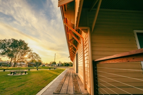 Old railway goods shed at Koondrook in golden afternoon sunlight - Australian Stock Image