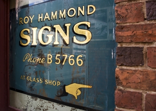 Old signage and brick wall in laneway - Australian Stock Image