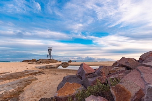 Old wooden lifeguard, shark lookout tower on Redhead Beach - Australian Stock Image