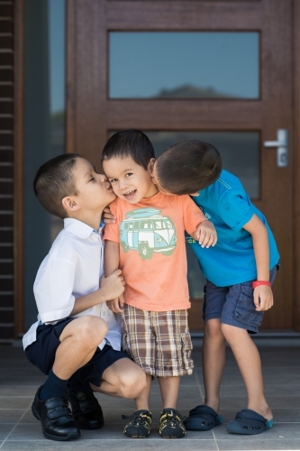 Older brother says goodbye to his siblings on his first day back at school