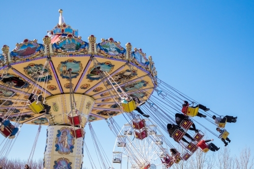 Ornamental swing chair ride with thrill seekers - Australian Stock Image