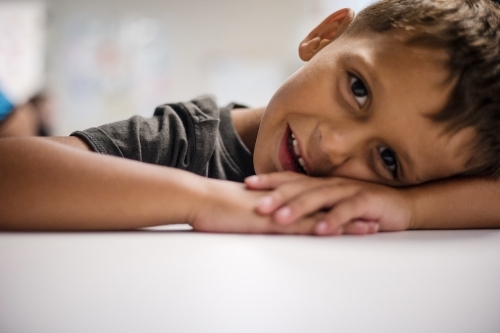 Out of focus portrait of young Aboriginal boy - Australian Stock Image