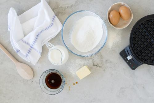 Overhead ingredients shot, preparing to make waffles - Australian Stock Image