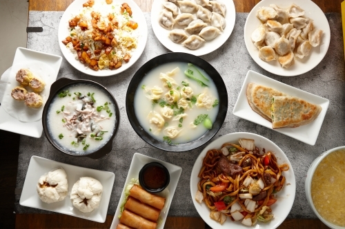 Overhead shot of different food dishes on a flat surface. - Australian Stock Image