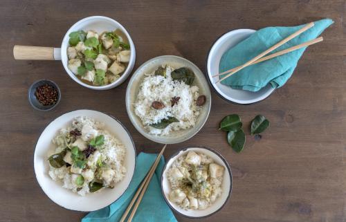 Overhead shot of seafood dish with rice presented on table - Australian Stock Image