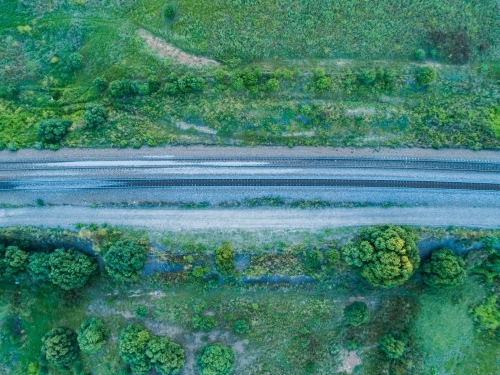 Overhead top down of empty railway track in countryside - Australian Stock Image