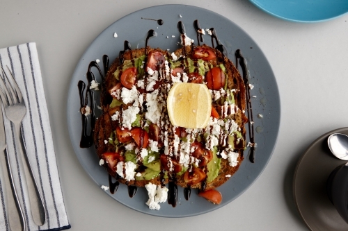 Overhead view of avocado on toast on table - Australian Stock Image