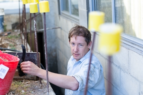 Owner builder working on a building project - Australian Stock Image