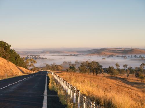 Oxley Highway approaching from the east of Walcha just after sunrise - Australian Stock Image
