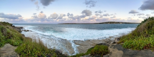 Panoramic photo of Hacking River and Bundeena at sunset with pink clouds - Australian Stock Image
